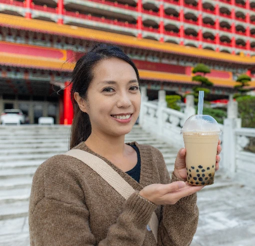 woman holding bubble tea with milk