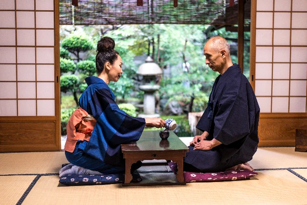 couple enjoying traditional japaness tea ceremony