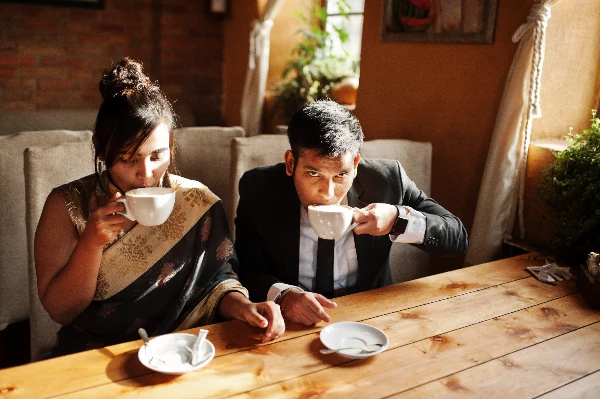 friends drinking darjeeling tea with caffeine