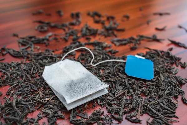 loose tea and tea bags on table