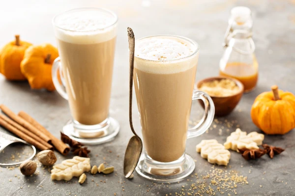 pumpkin spice chai latte in tall mugs