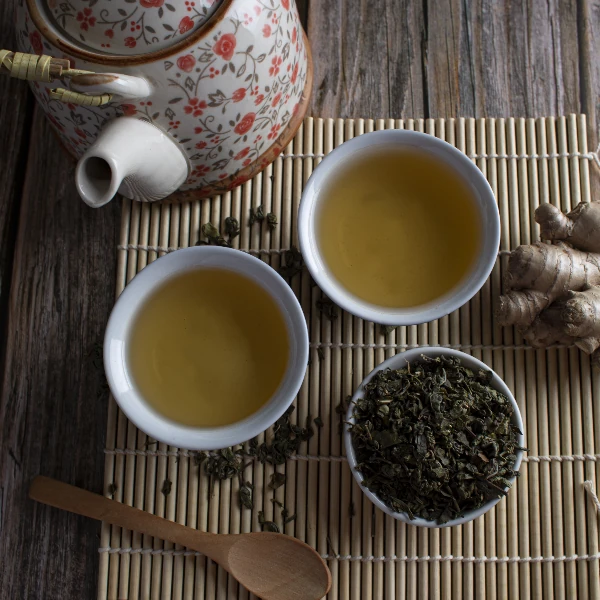 top view of green leaf tea cup and pot