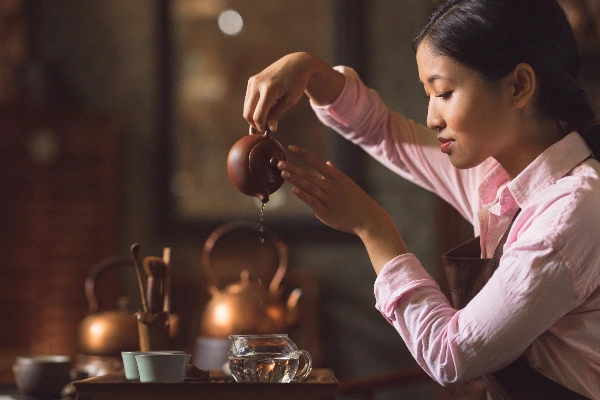 woman brewing chinese tea