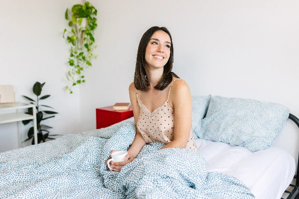 woman drinking green tea at night before bedtime