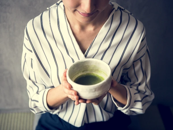 woman drinking matcha tea