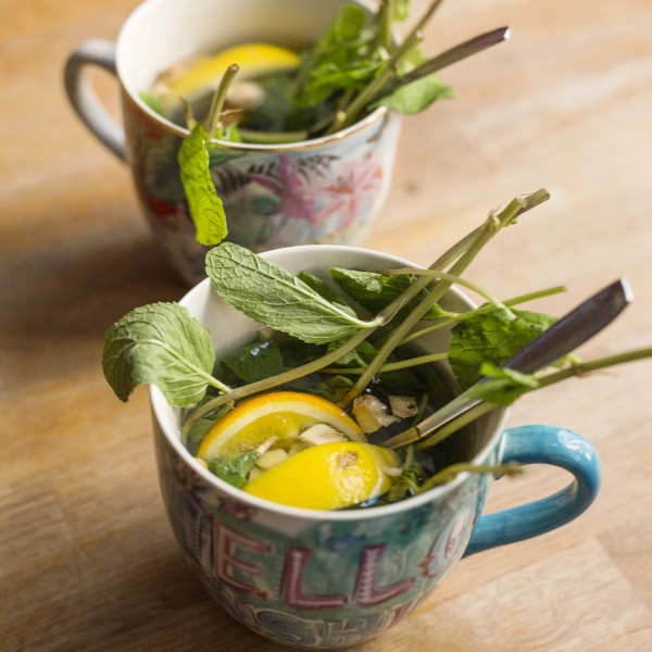 two cups with lemon balm tea